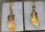 Copper feather pendant necklaces; by Wesley Havill